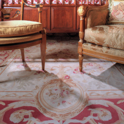 French Auboson Rug with Hand Carved Italian Chest and Chairs scaled 1